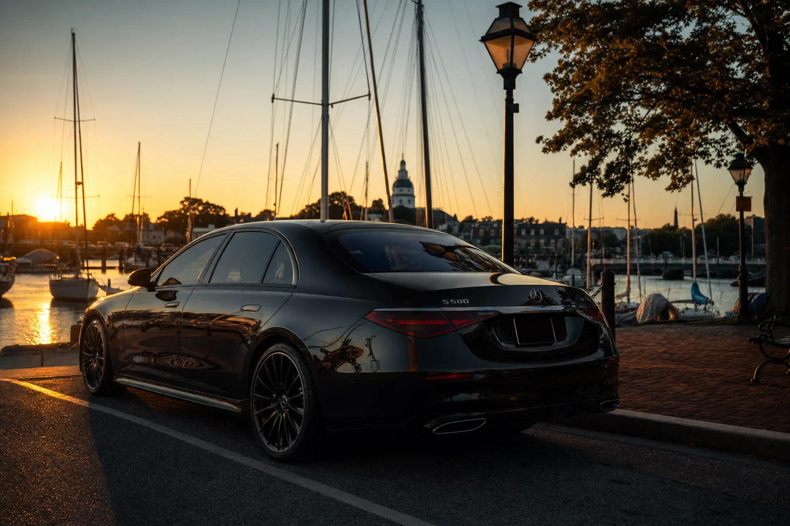 Black Mercedes-Benz S580 sedan in Annapolis, MD at golden hour, Monarch luxury chauffeur service