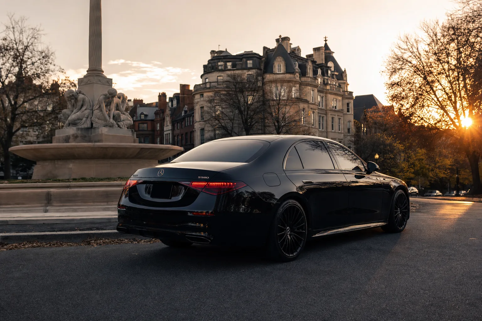 Black Mercedes-Benz S580 sedan in Dupont Circle, DC at golden hour, Monarch luxury chauffeur service