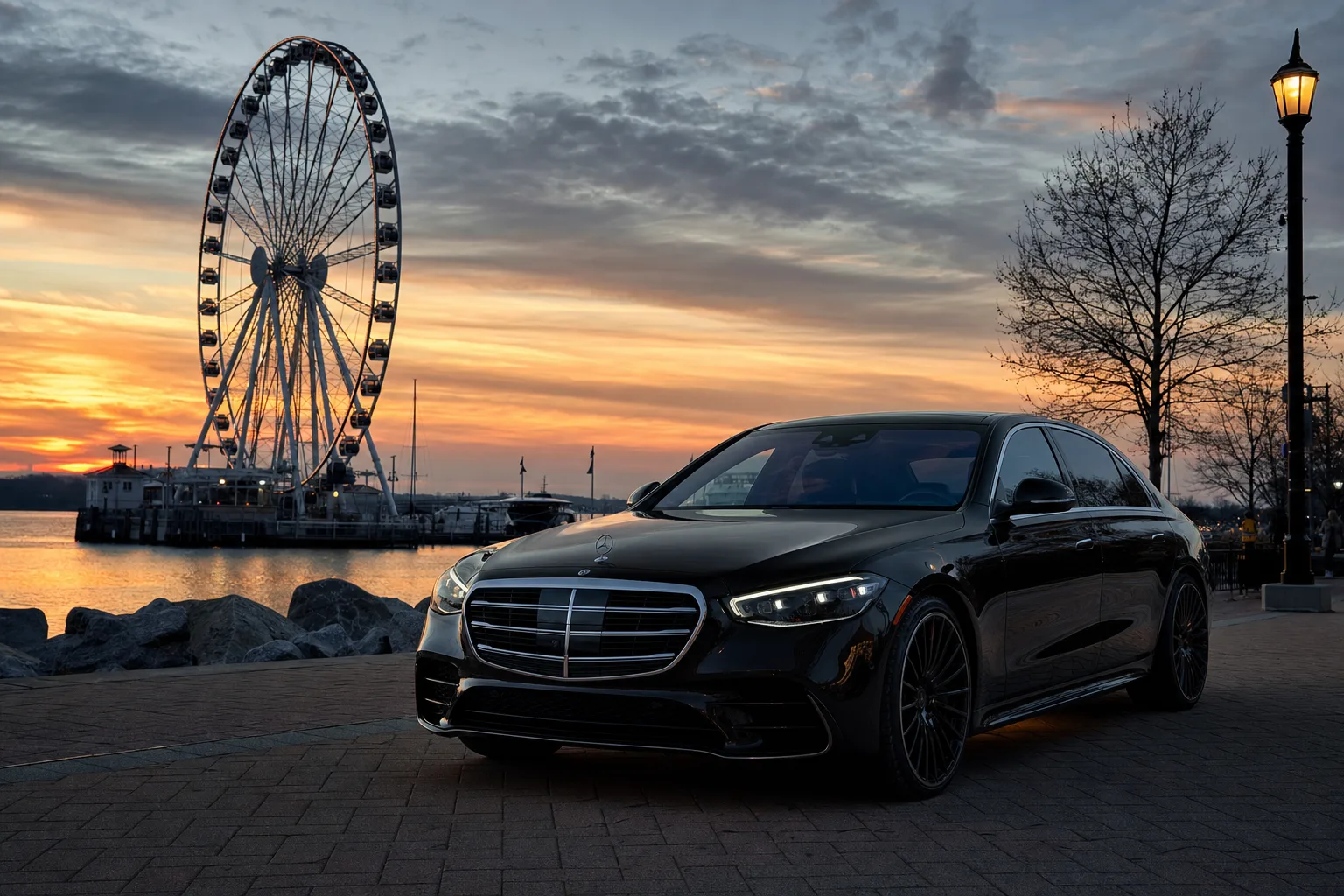 Black Mercedes-Benz S580 sedan in National Harbor, MD at golden hour, Monarch luxury chauffeur service