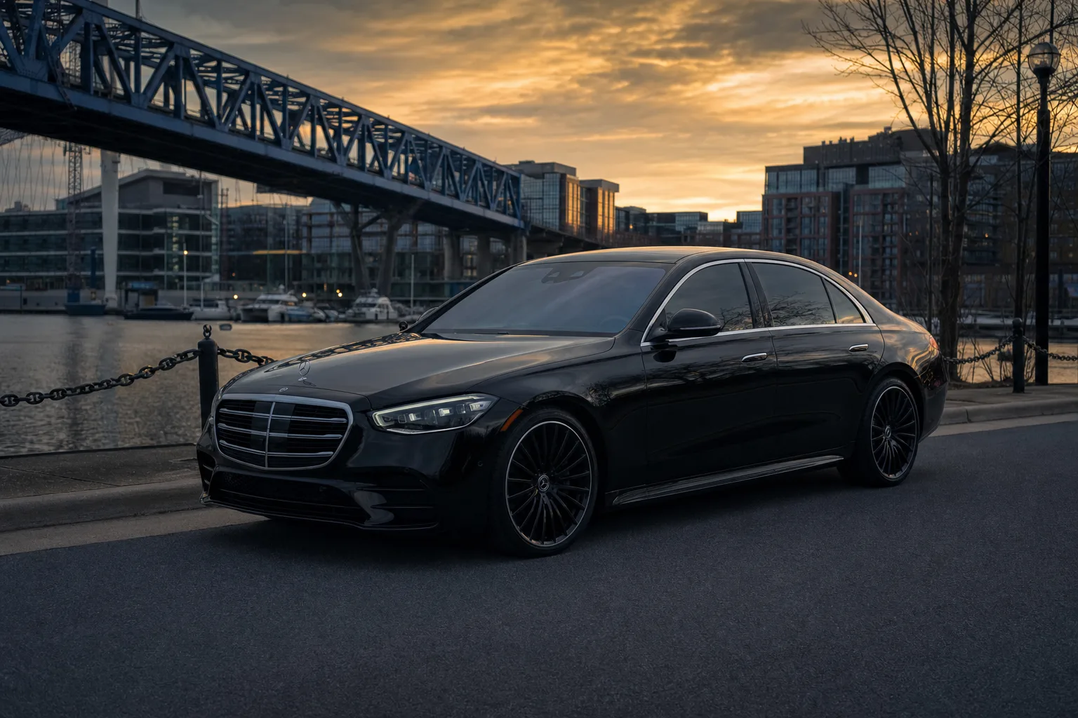 Black Mercedes-Benz S580 sedan in Navy Yard, DC at golden hour, Monarch luxury chauffeur service