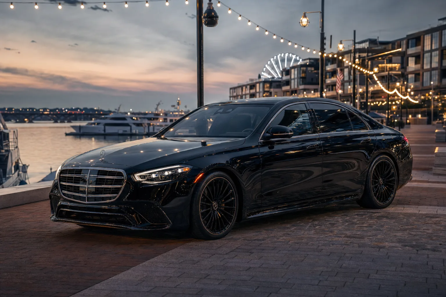 Black Mercedes-Benz S580 sedan in The Wharf, DC at golden hour, Monarch luxury chauffeur service