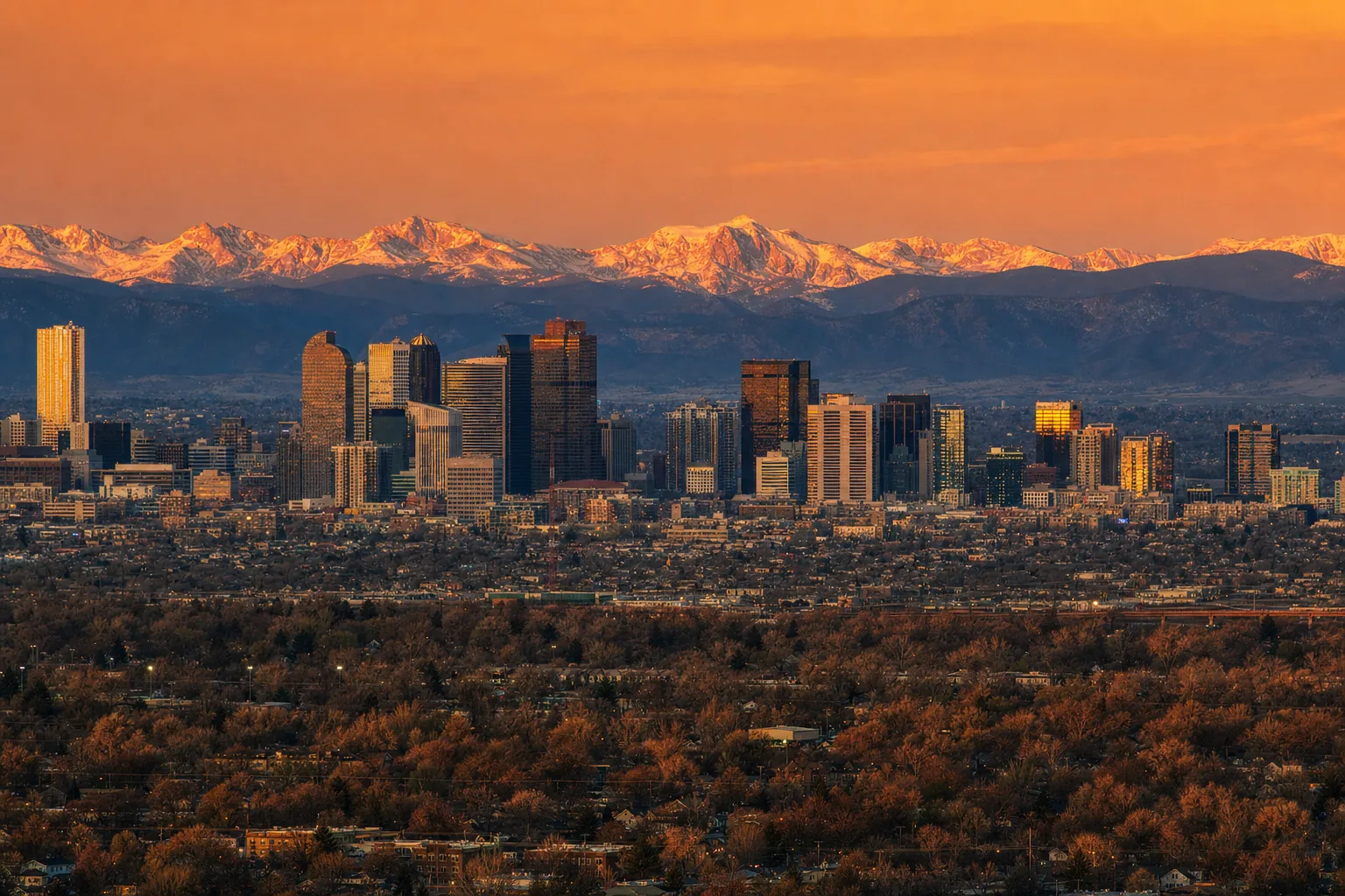Denver, CO skyline at dusk, served by Monarch chauffeur and limo service